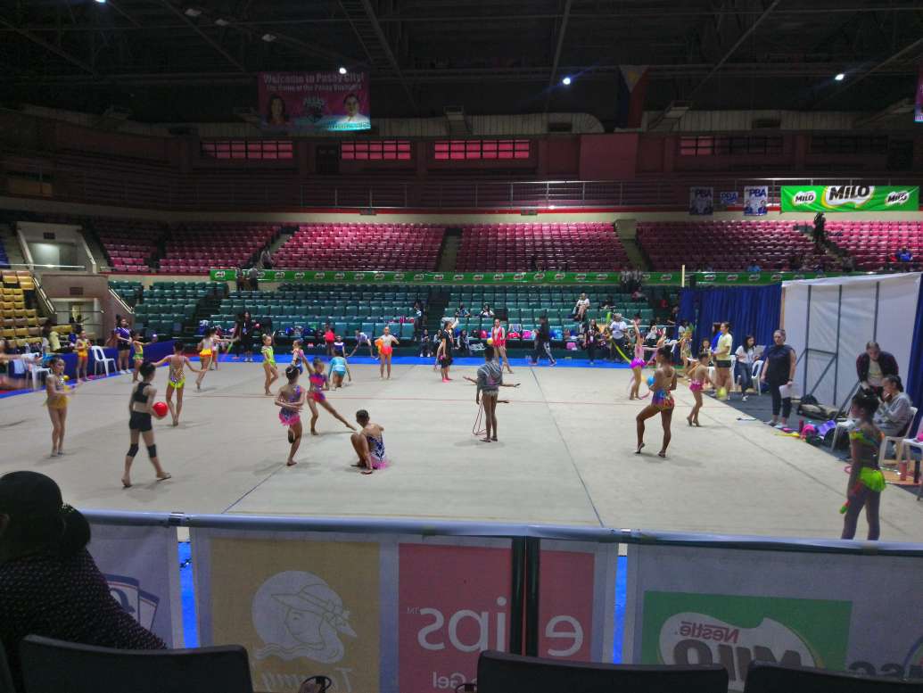 A warm up carpet filled with gymnasts
